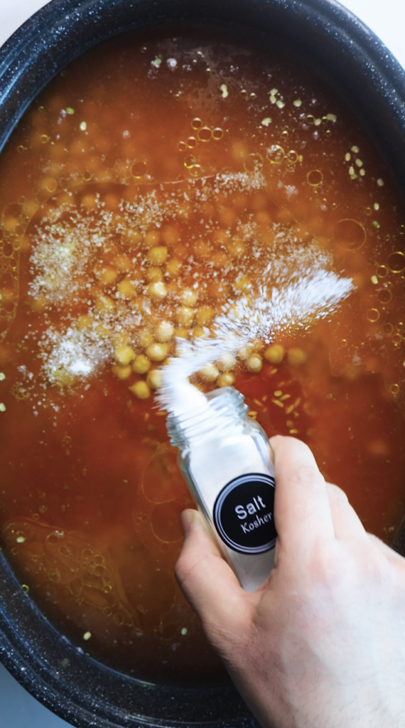 1. Add rinsed rice and mung beans to a large Dutch oven, then add water, beef broth, tomato sauce, oil, chickpeas, seasonings, and cilantro. 